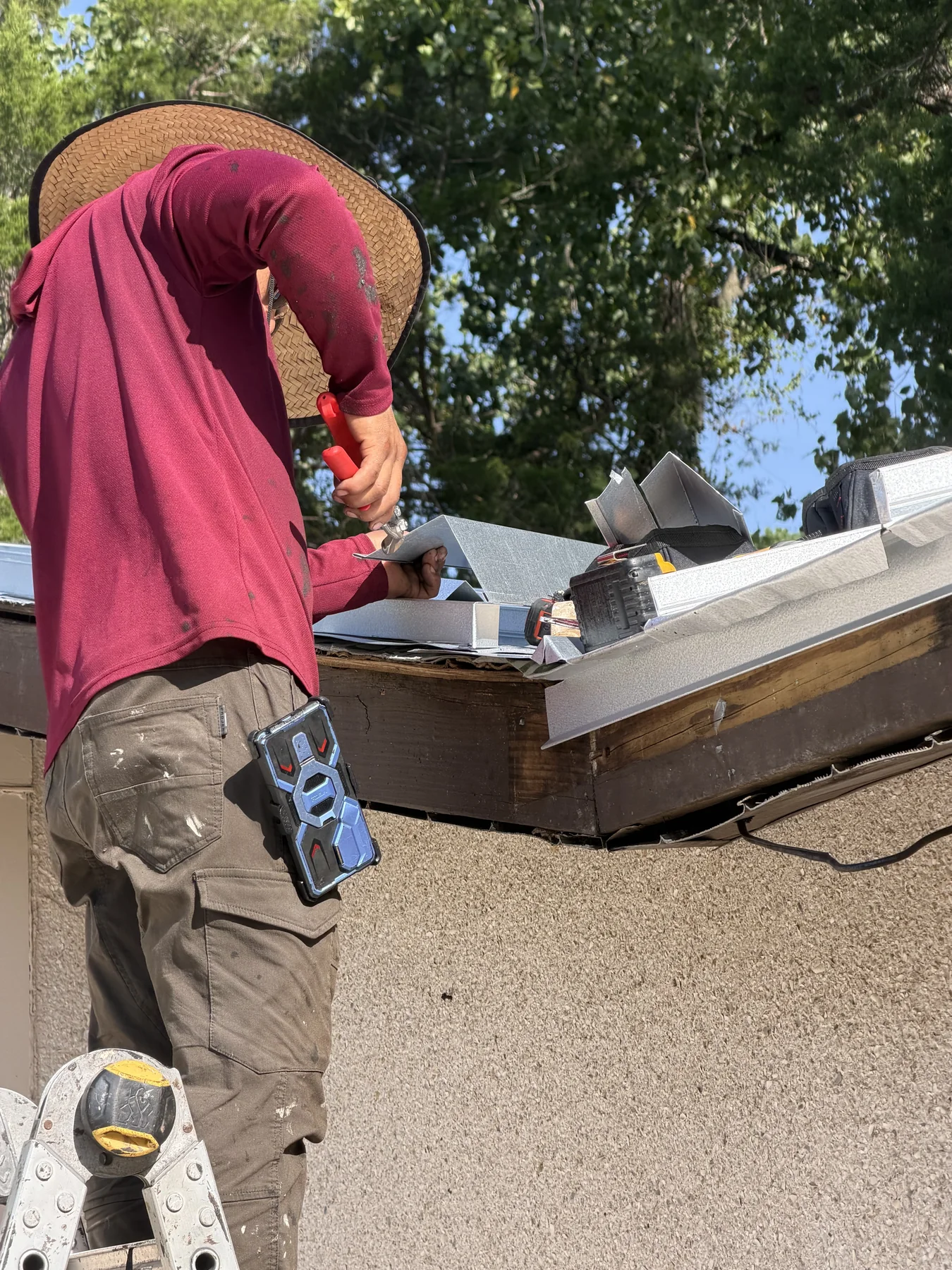 Technician completing gutter repair work