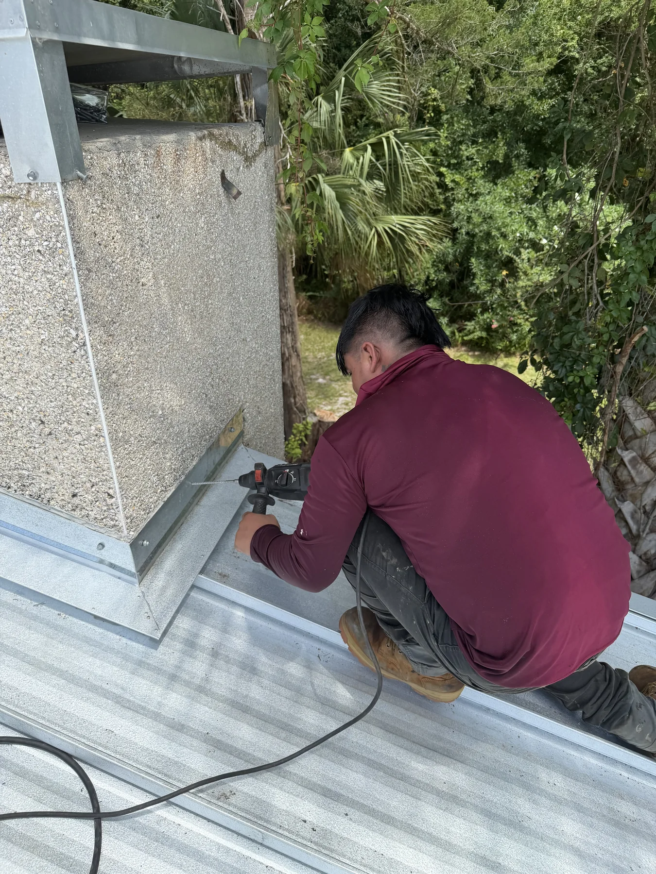 Roof edge and gutter repair in progress